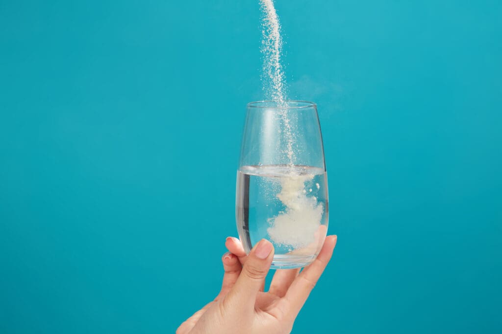 Powder dissolving in a glass of water