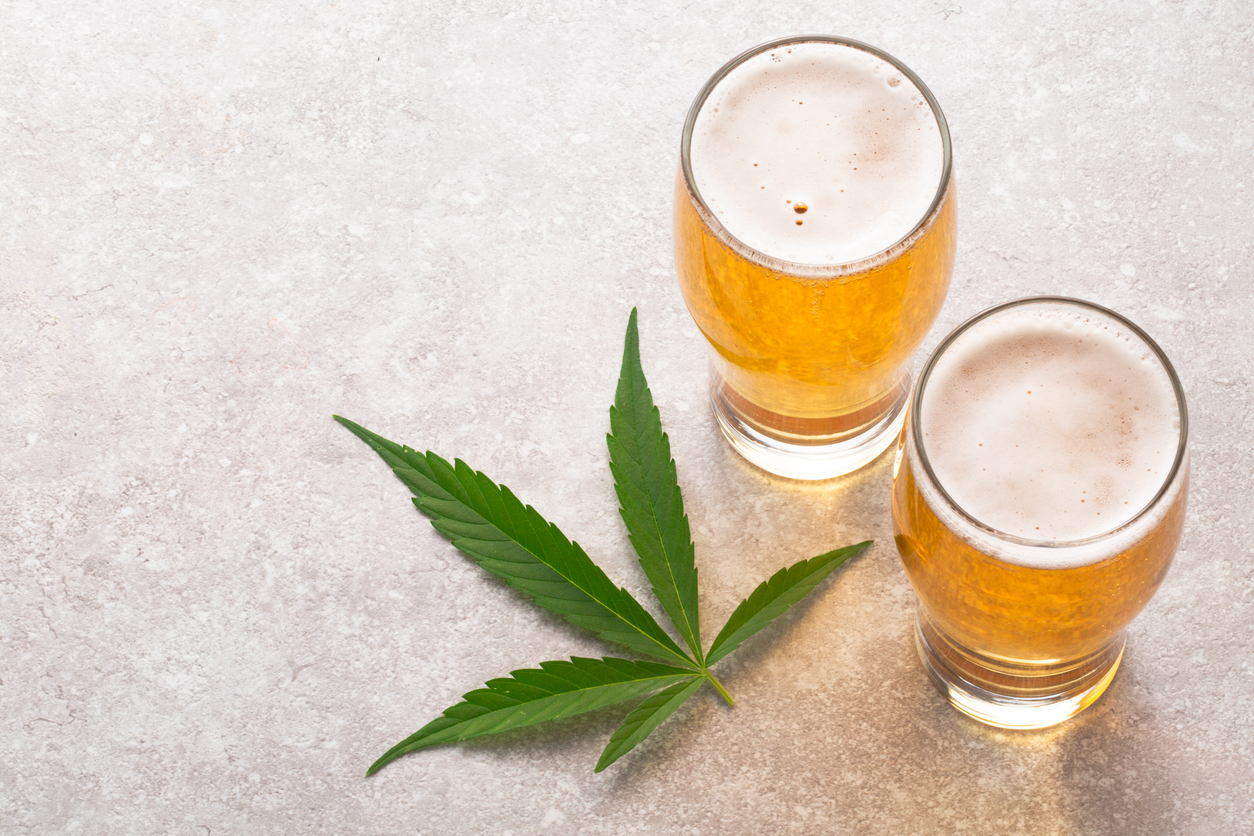 Two beer glasses with a cannabis leaf.