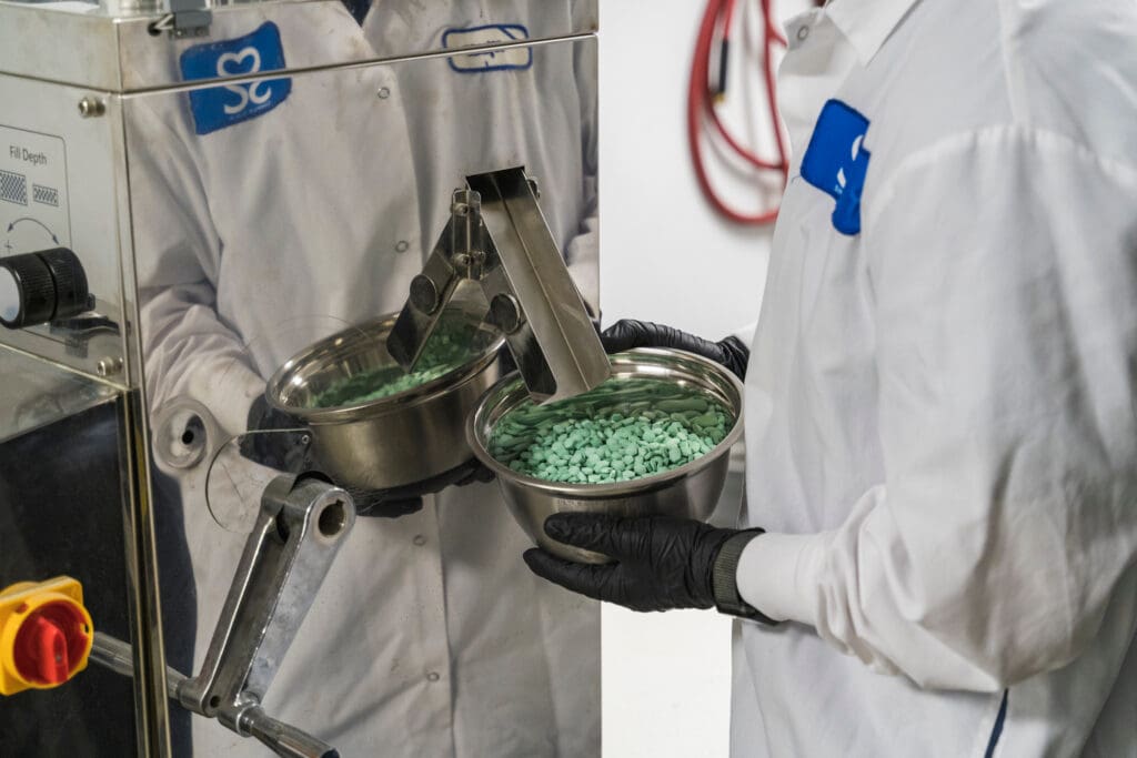 Scientist inspecting CBD oil samples in a modern lab.